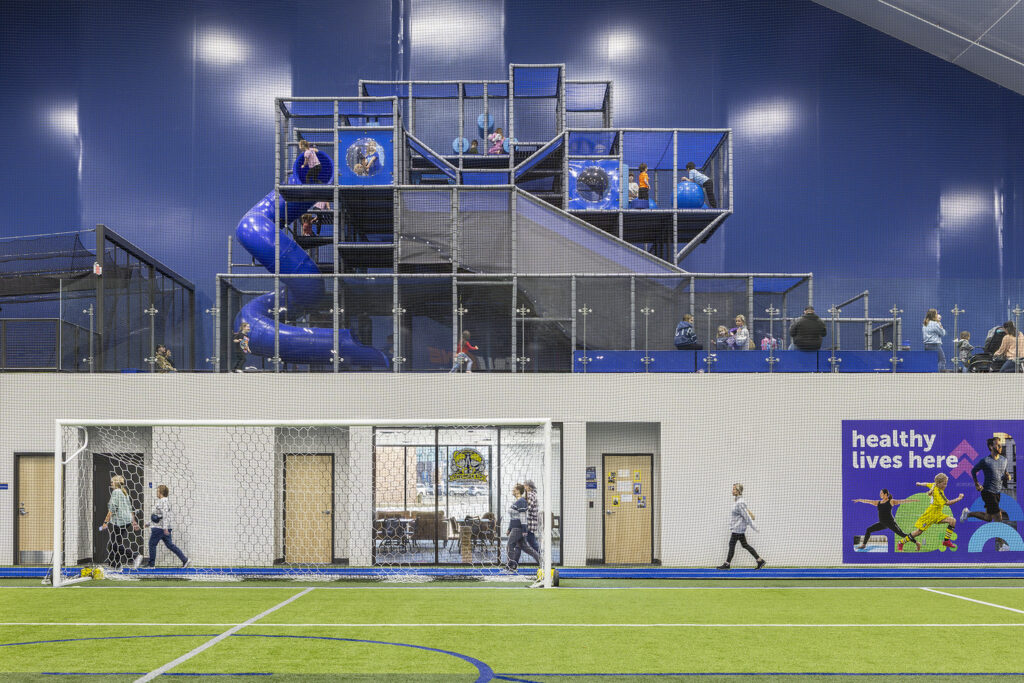 A children's playground on second level at an indoor municipal fieldhouse